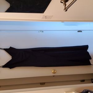 Navy gown, fitted, high slit.